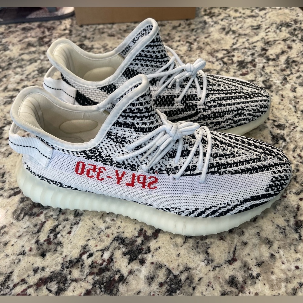 Yeezy’s white/black size 9 1/2 in perfect condition.